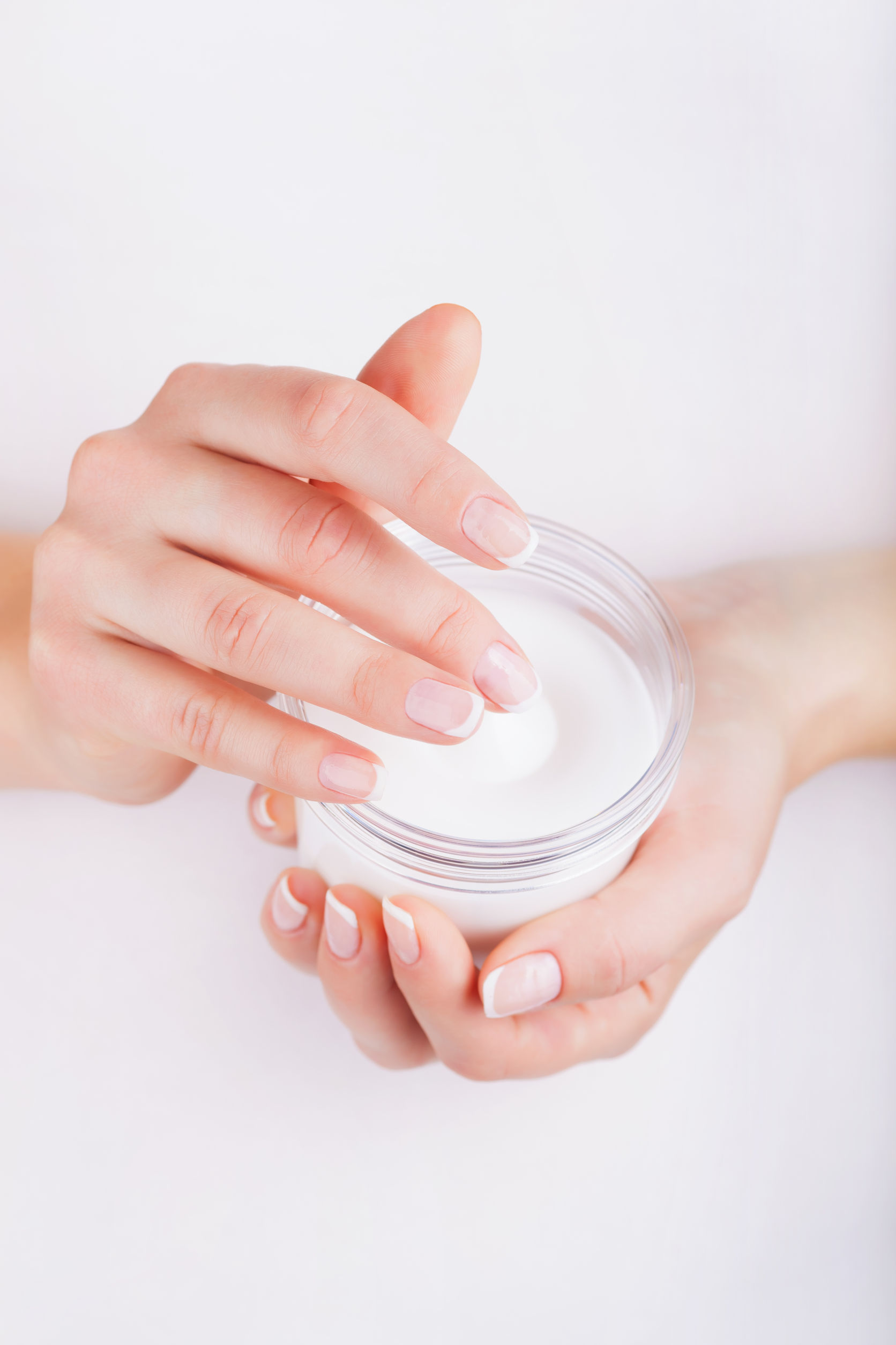 36734796 - woman applying cream on hands